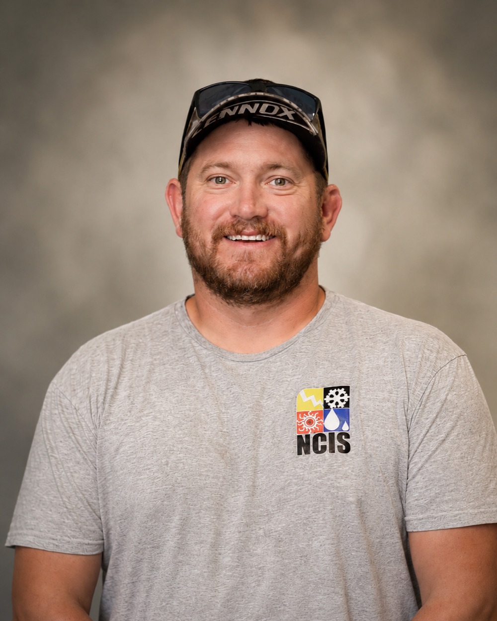 Mitch Fridolfson, founder of North Central Iowa Service, in a company shirt.