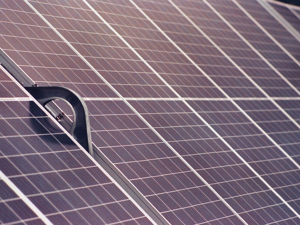 Close-up of a photovoltaic solar panel array, representative of residential and commercial solar energy installation.