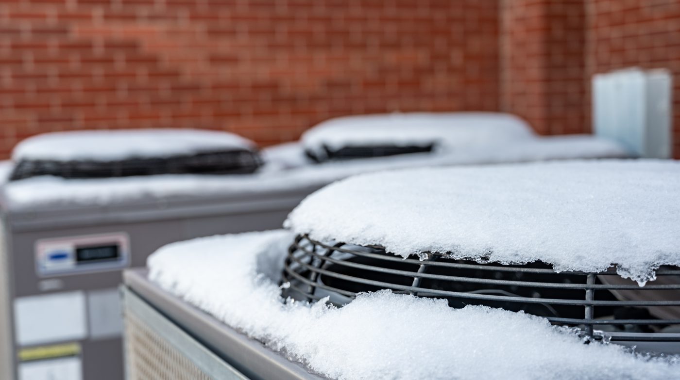Snow piled on outdoor condensers near Clarion during a North Central Iowa winter.